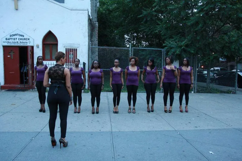 A circle of women standing together outdoors